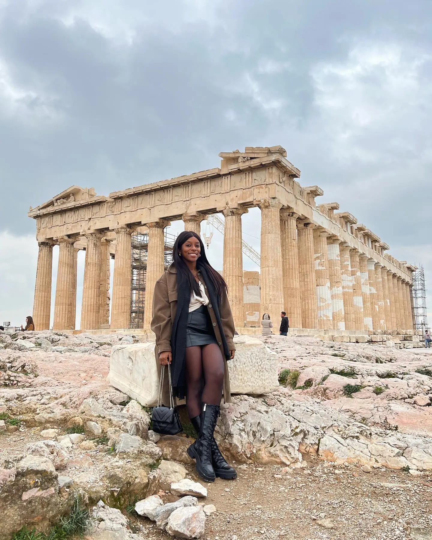 Melody standing before the Parthenon's columns