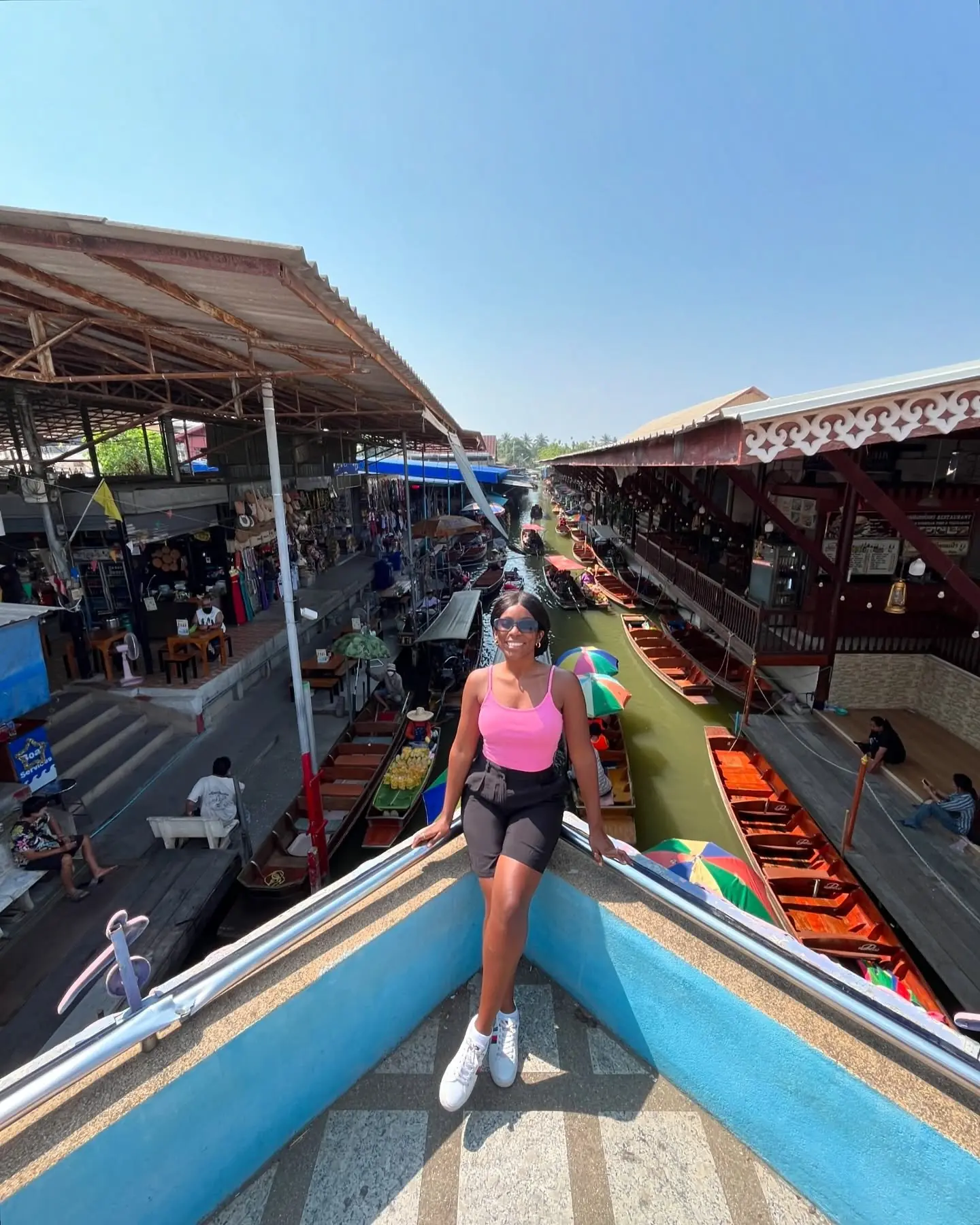 Long-tail boats packed into the canals of a floating market