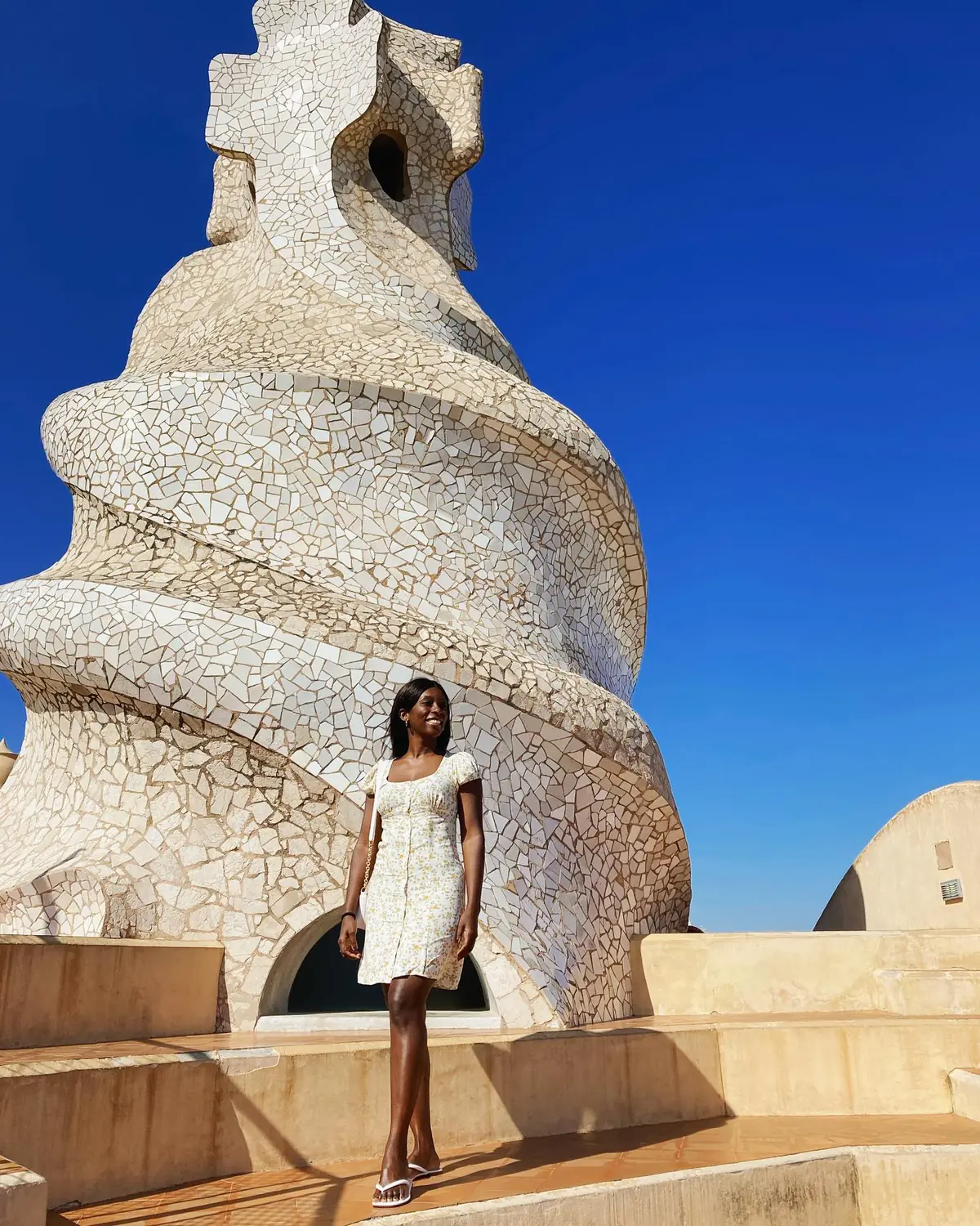 Melody on the rooftop of La Pedrera among Gaudí's mosaic warrior chimneys