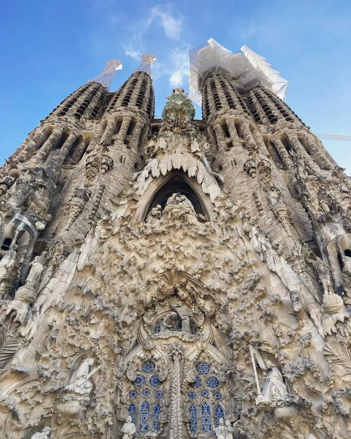 Looking straight up the intricately carved Nativity facade of the Sagrada Família