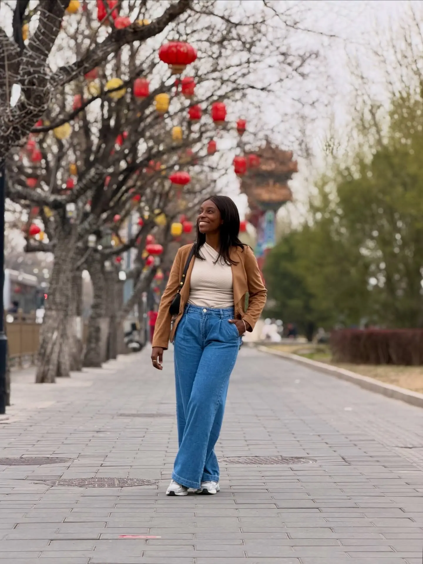 Walking a lantern-lined avenue in old Beijing