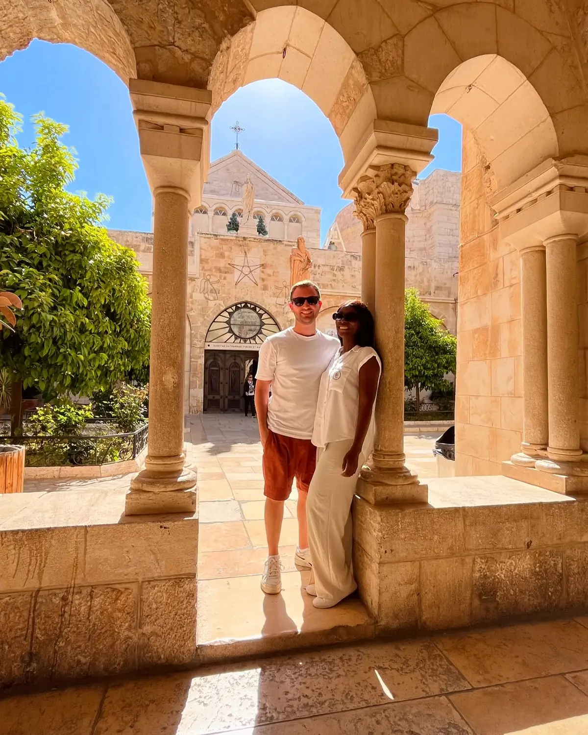 Us under the stone arches by the Church of the Nativity in Bethlehem