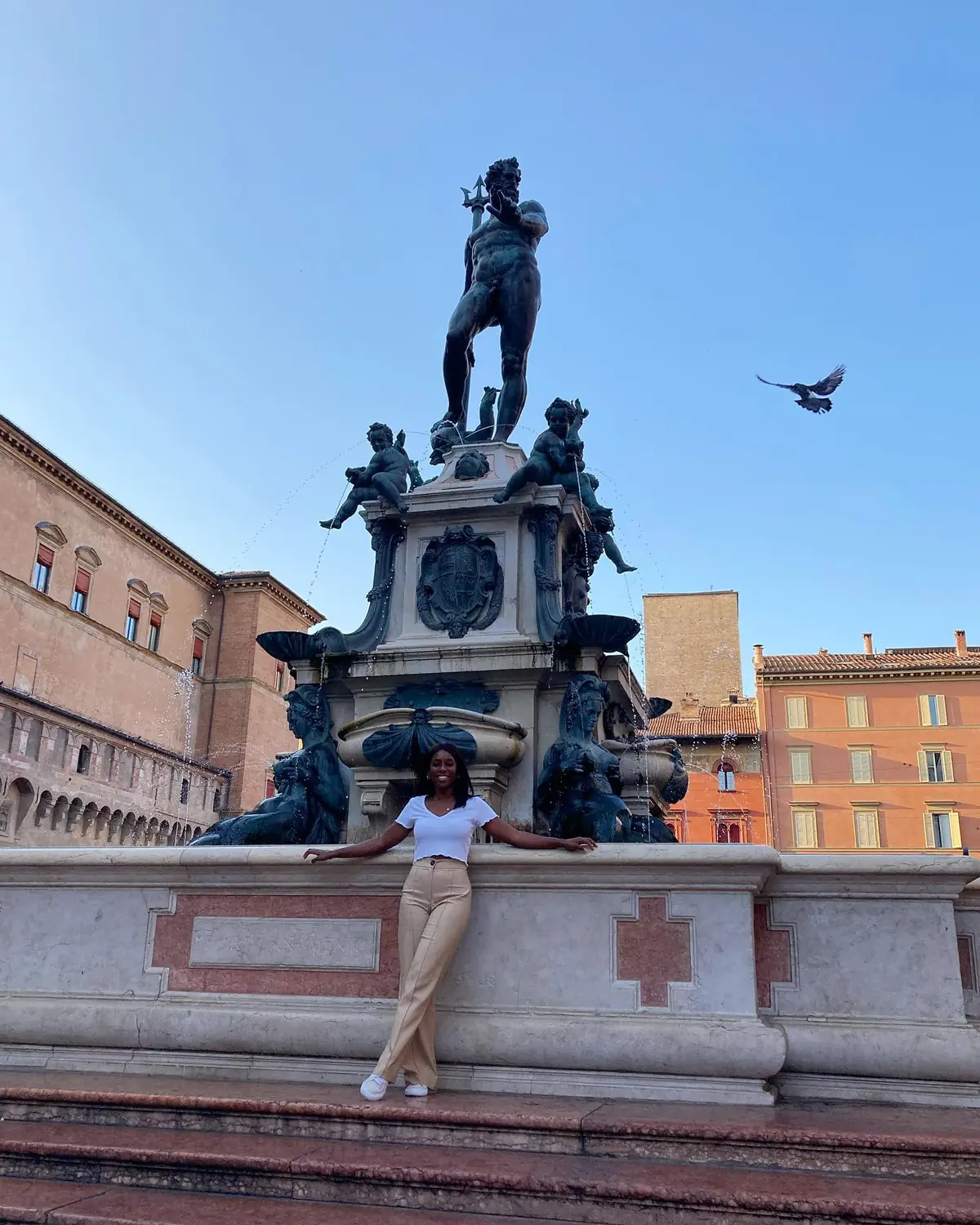 Melody in front of the bronze Fountain of Neptune in Bologna