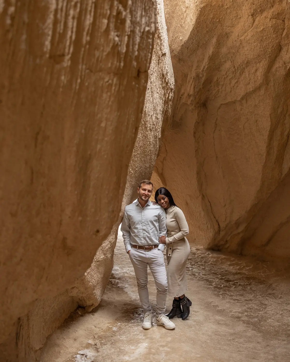 Us standing in a narrow sandstone slot canyon