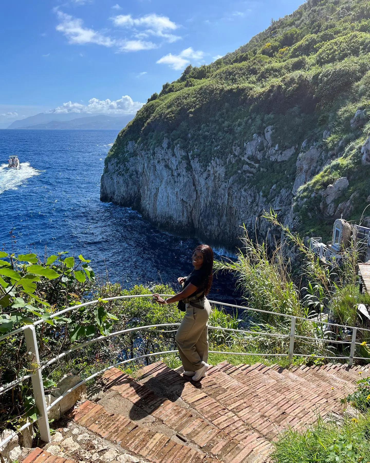On the cliffside steps above deep-blue water on Capri