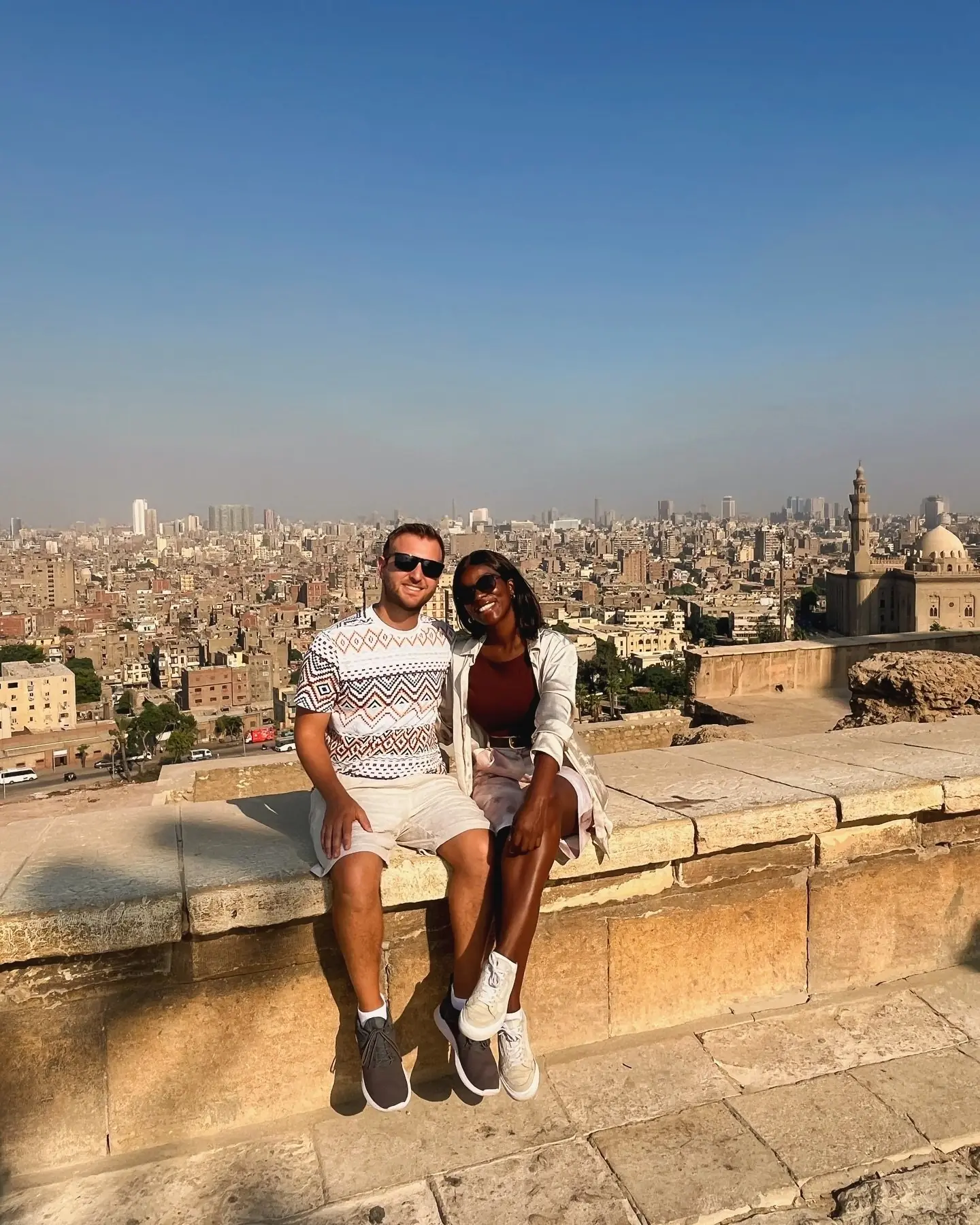 Couple overlooking Cairo and its mosques from the Citadel