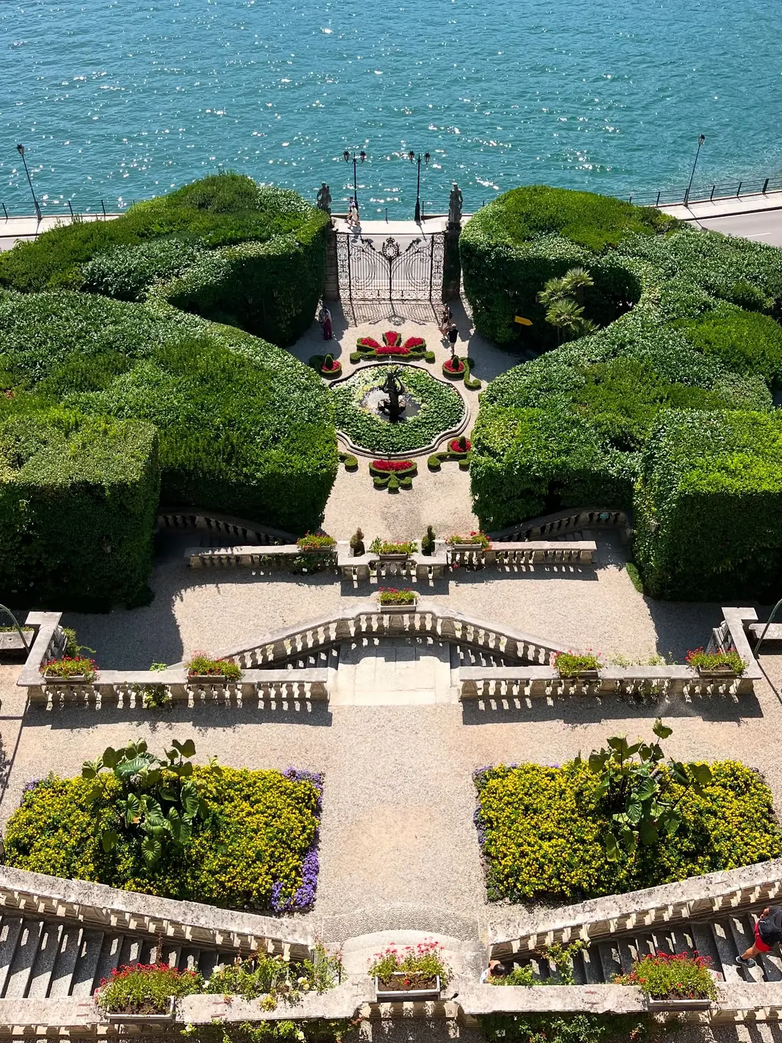 Villa Carlotta's terraced formal garden of clipped hedges and staircases dropping to the lake
