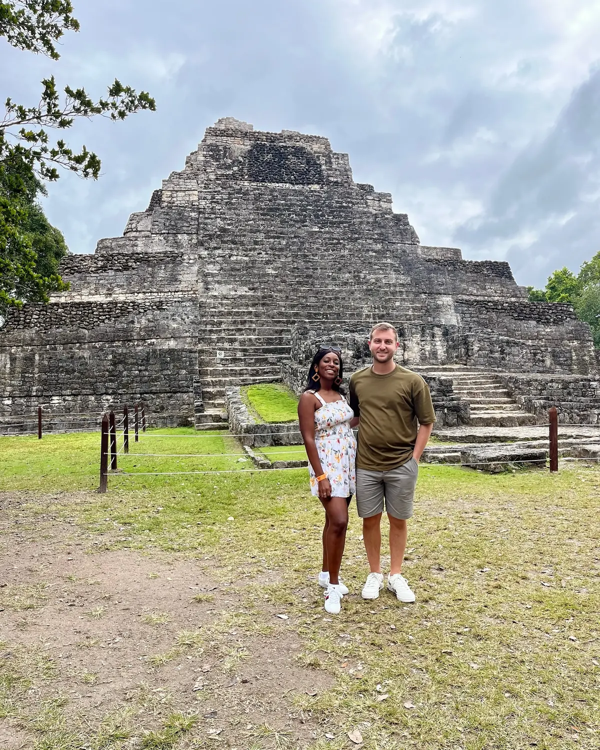 Us in front of the stepped stone pyramid at the Chacchoben Mayan ruins near Costa Maya