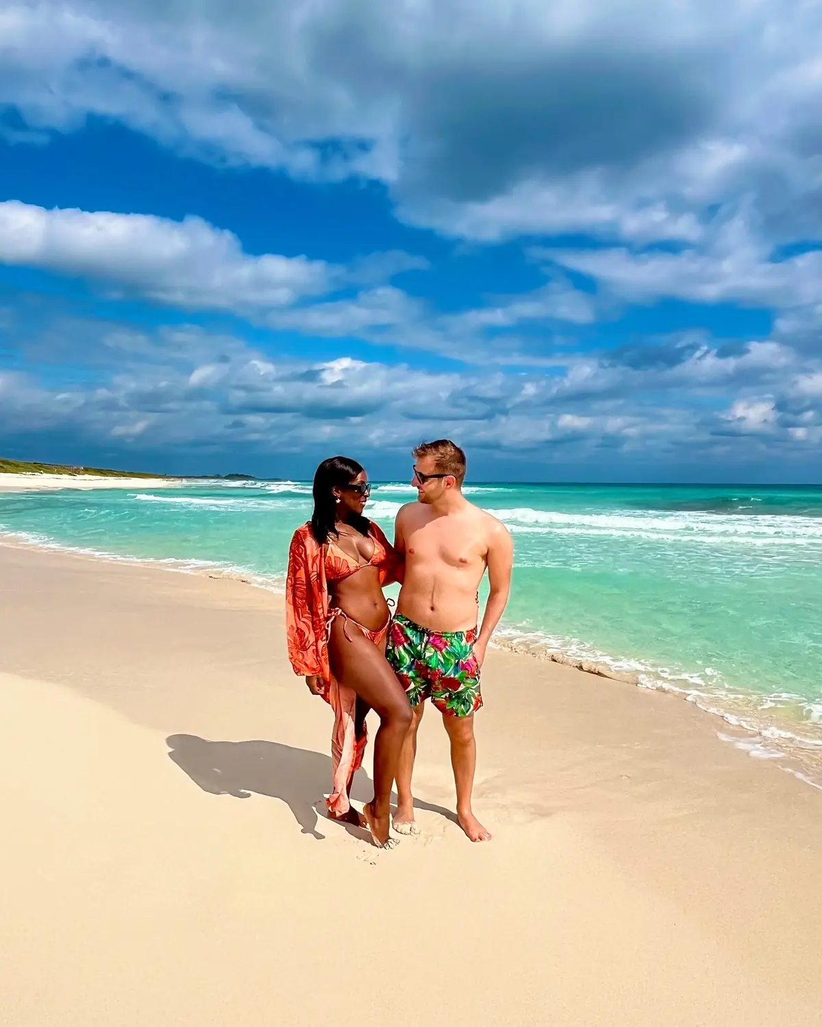 Us on a turquoise Cozumel beach in Mexico