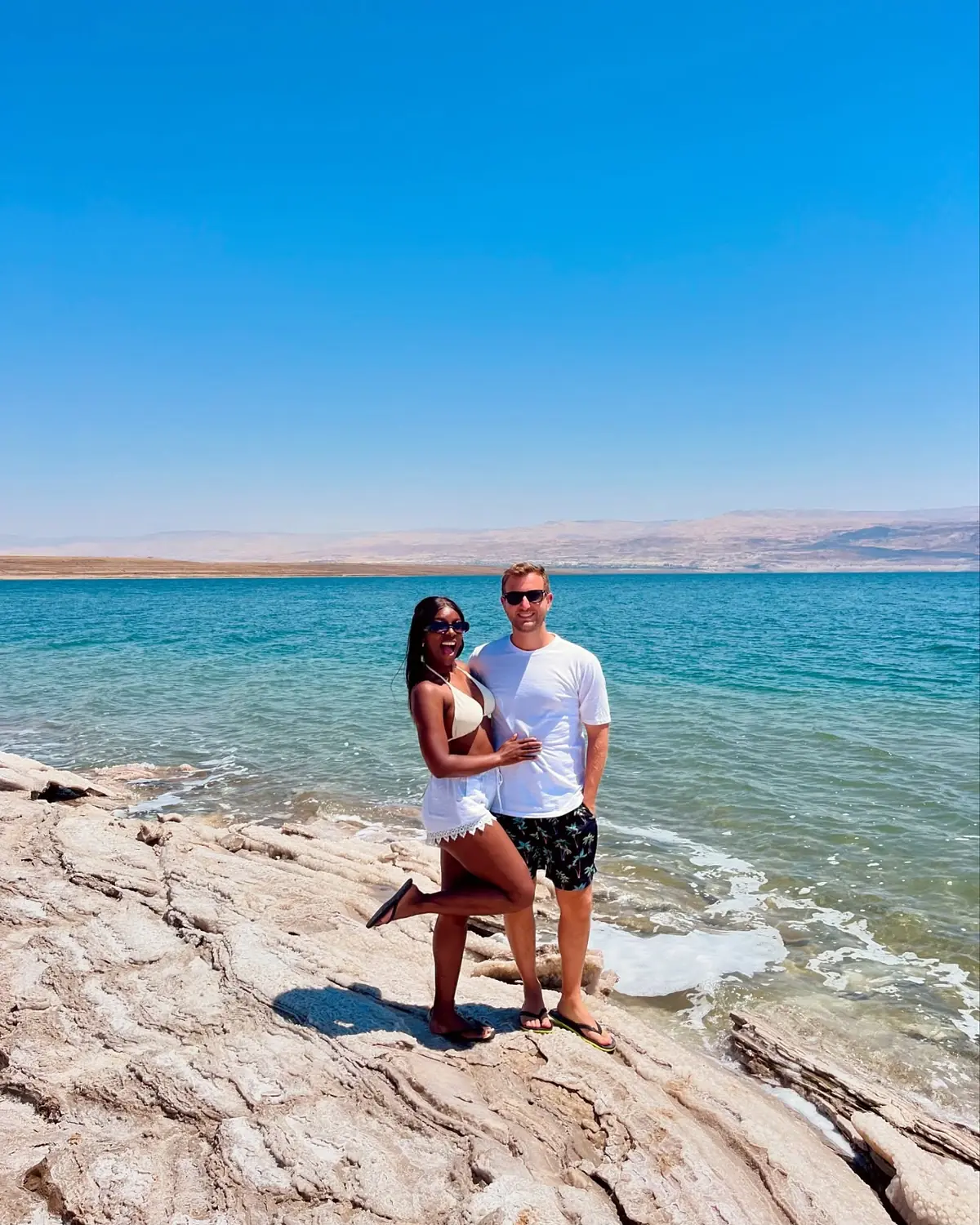 Us on the salt-crusted shore of the Dead Sea