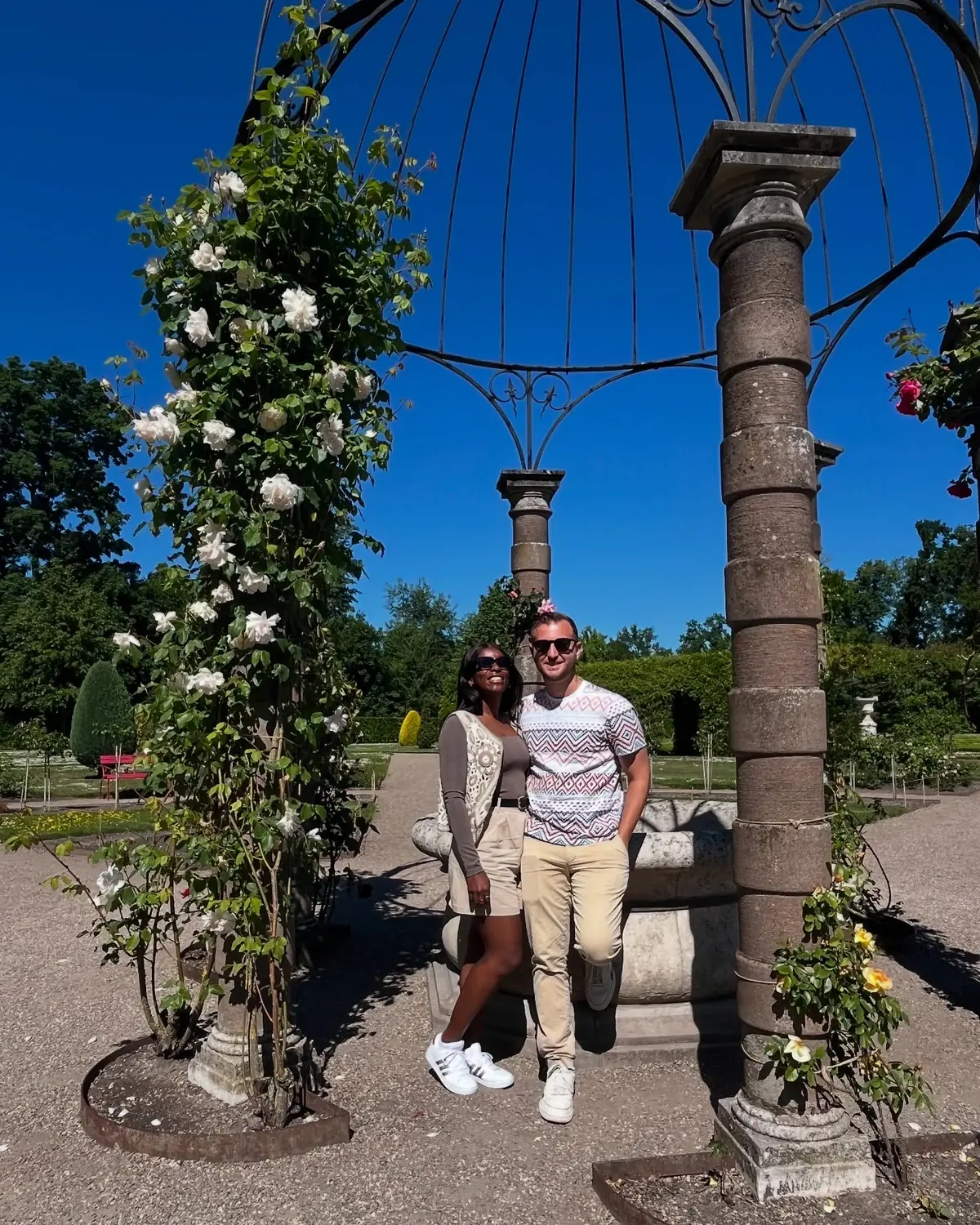 Us under a rose-covered pergola in the gardens of Kasteel de Haar