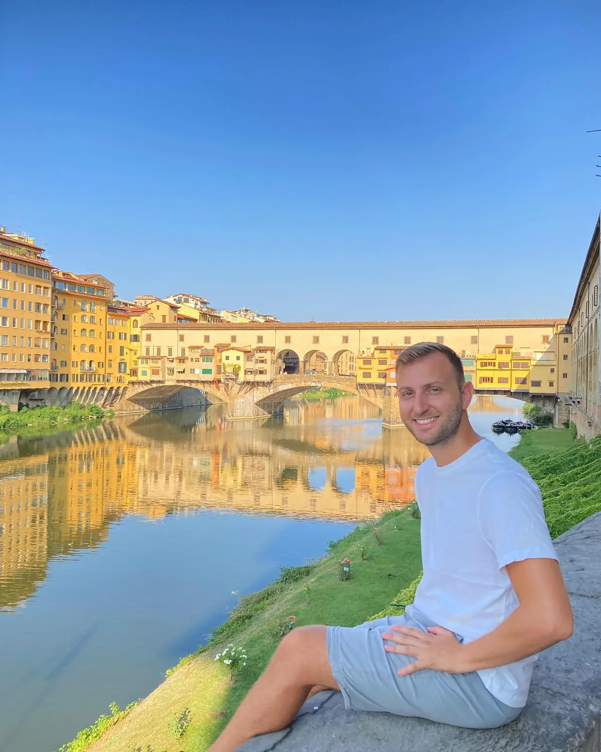Andrew by the Arno with the Ponte Vecchio and its overhanging shops behind