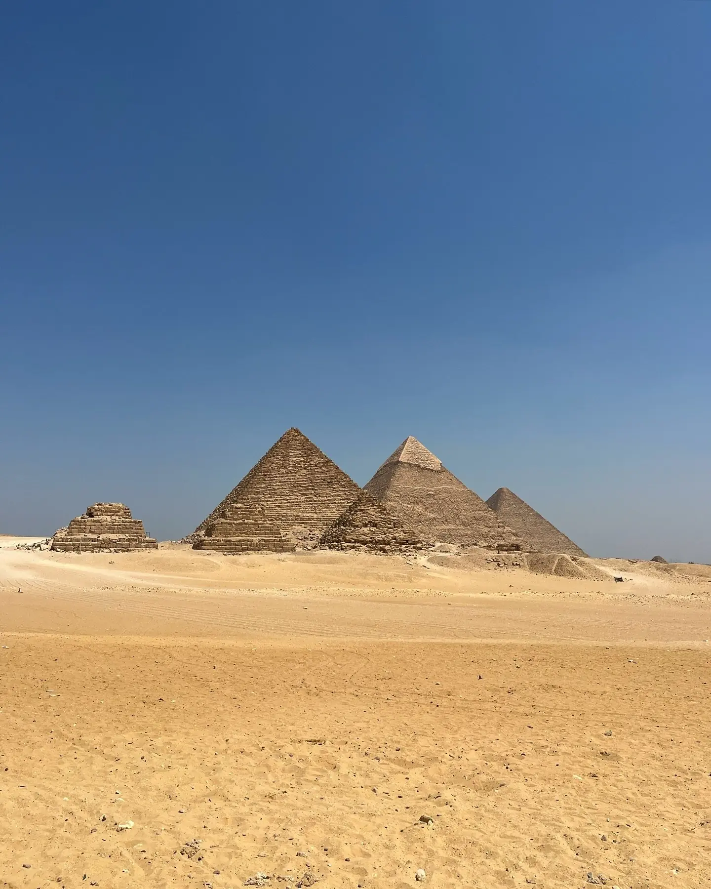 The three Great Pyramids of Giza rising from the desert