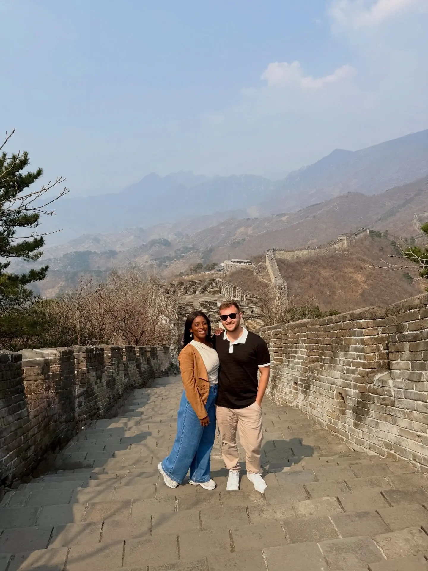 The Great Wall snaking into the misty mountains at Mutianyu