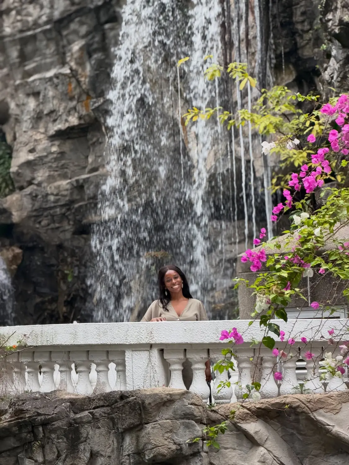 Melody by a waterfall and bougainvillea in Hong Kong Park