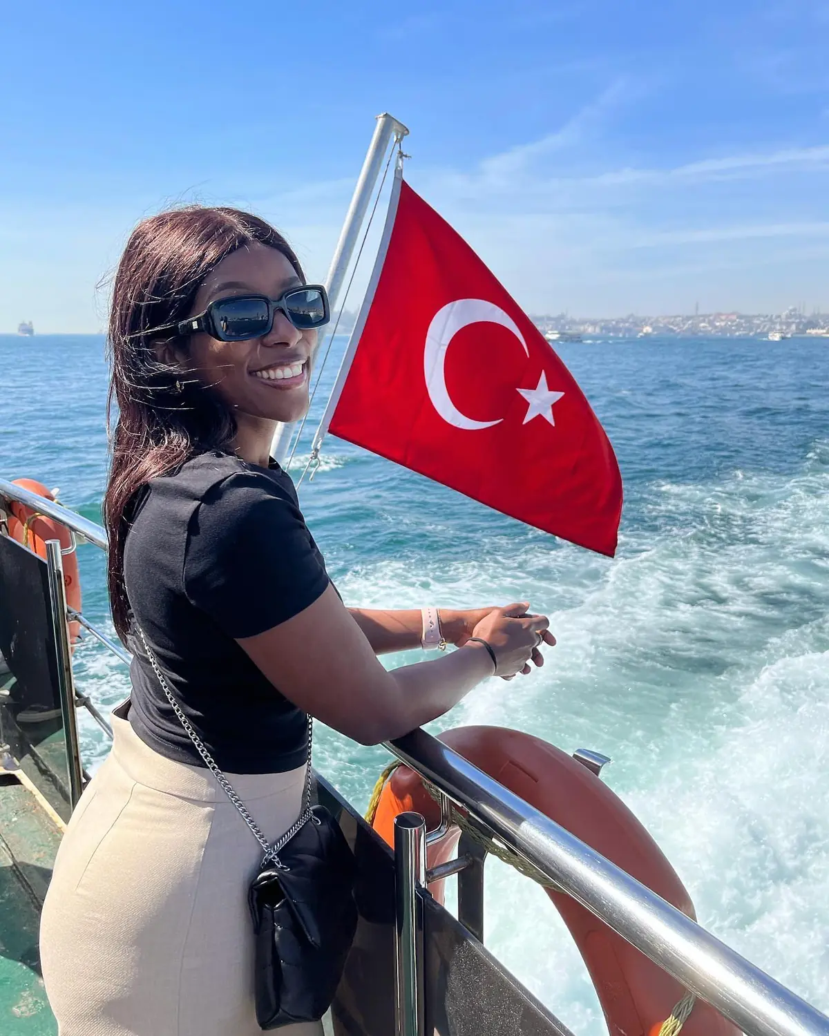Melody by the Turkish flag on a ferry crossing the Bosphorus
