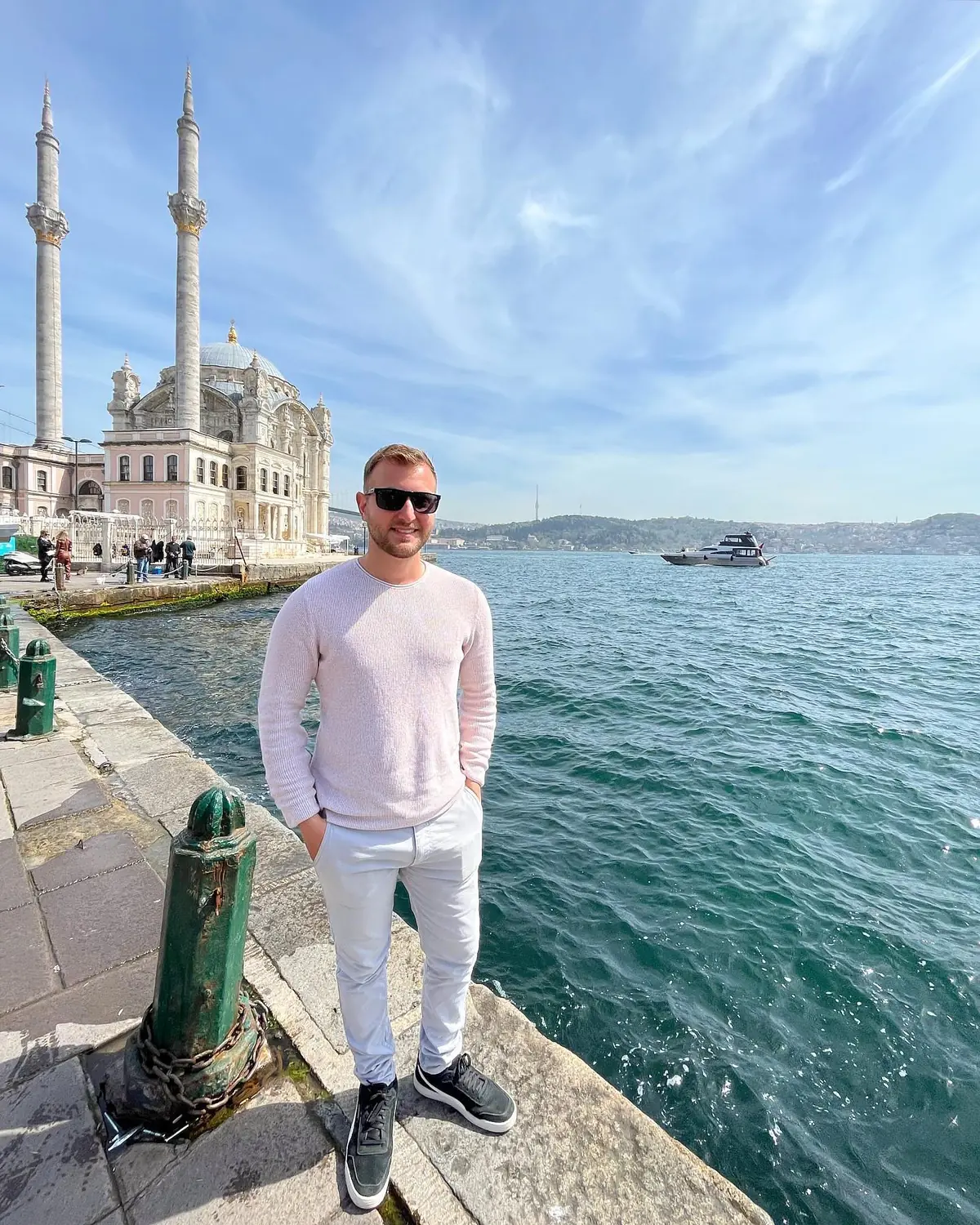 Andrew on the waterfront by Ortaköy Mosque with the Bosphorus bridge behind