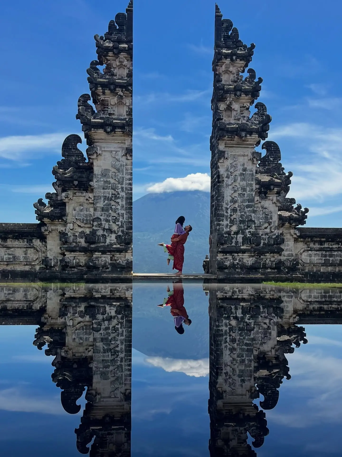 Couple lifted in a pose at the Gates of Heaven, Lempuyang