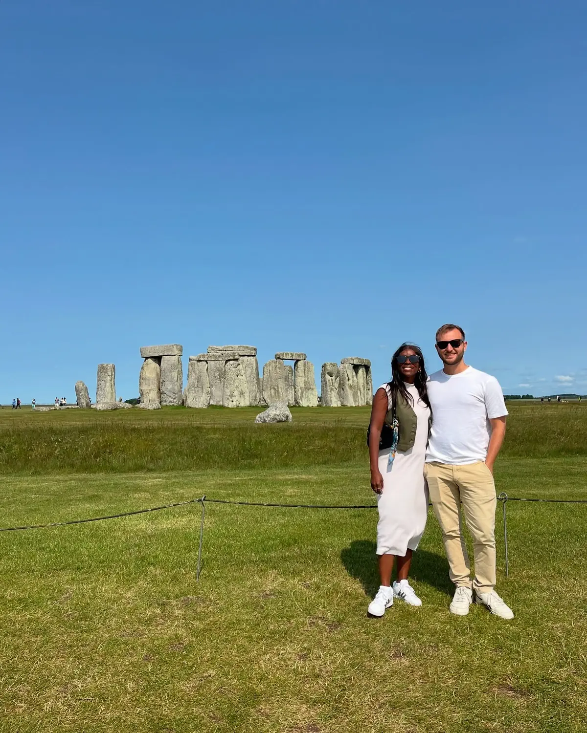 Us close in front of the Stonehenge stones