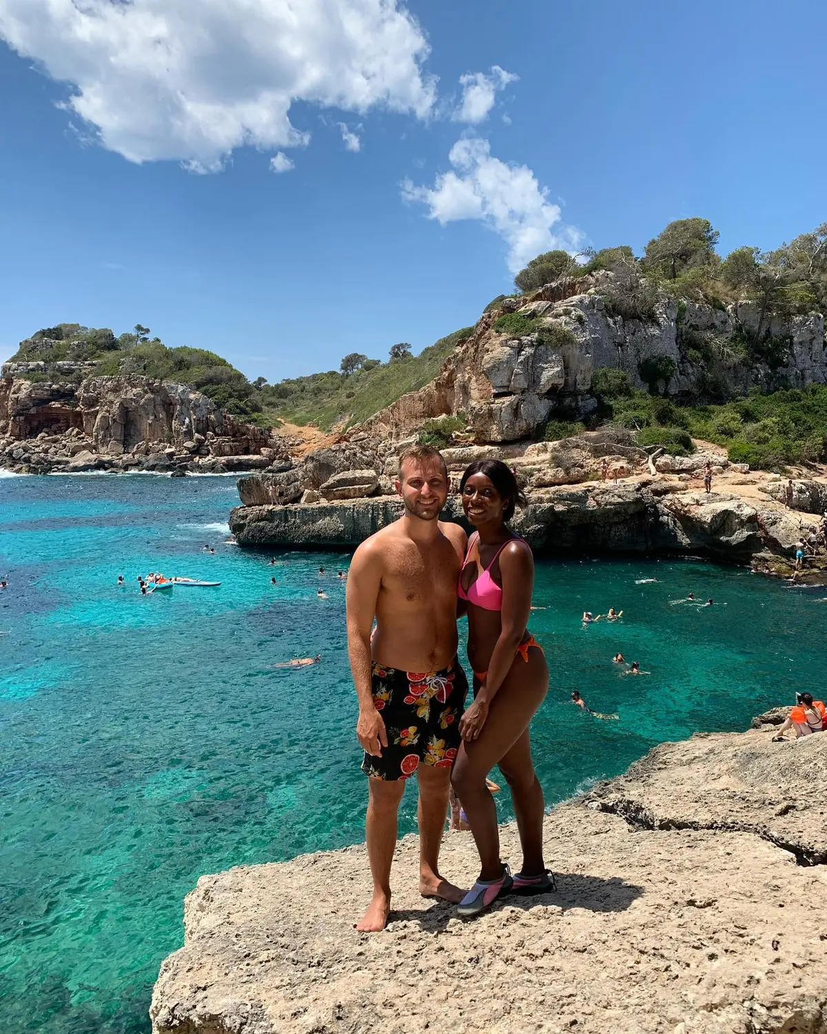 Us on the rocks above the famous turquoise cove of Caló des Moro, Mallorca