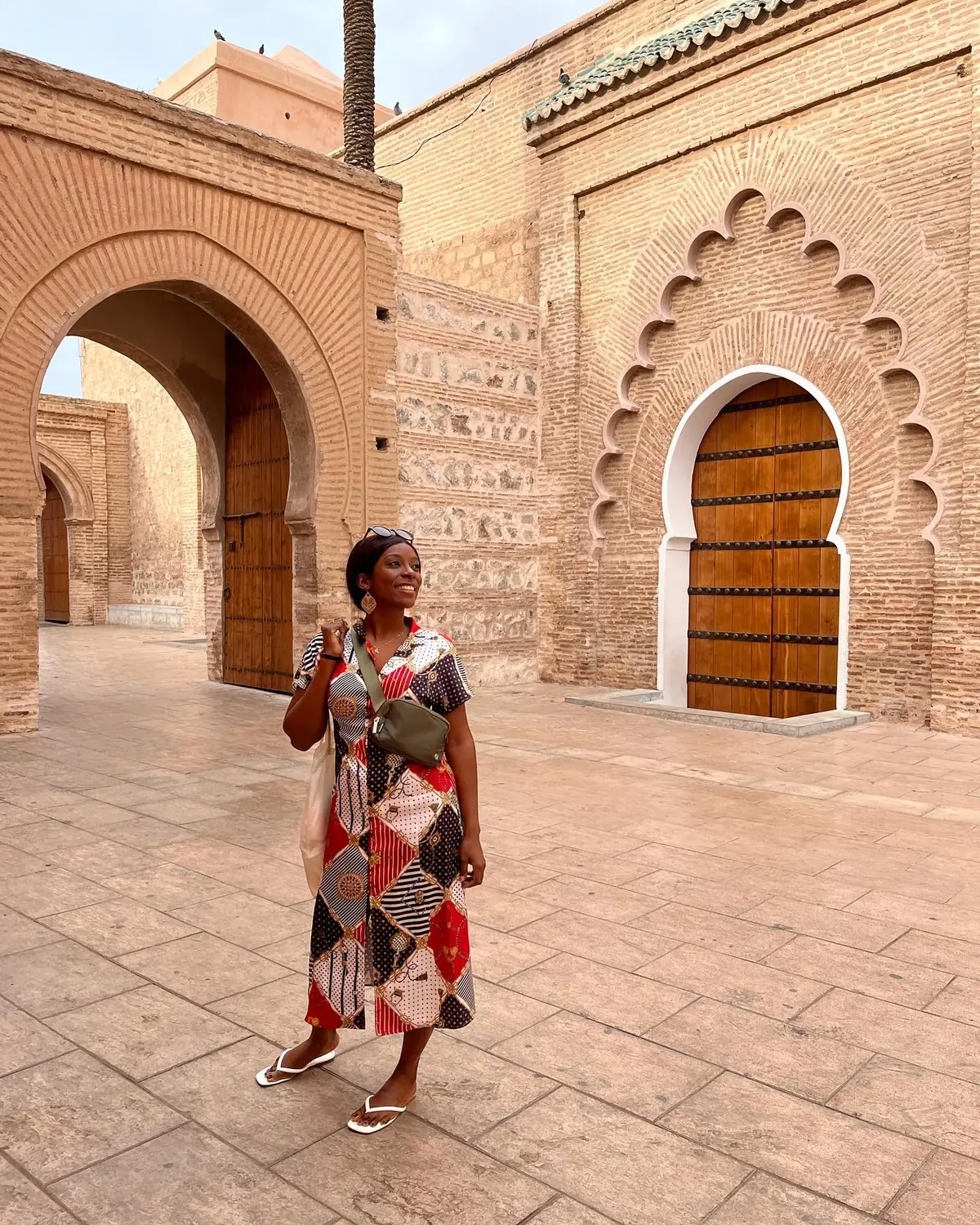 Melody by the scalloped brick arches and ochre walls near the Koutoubia Mosque