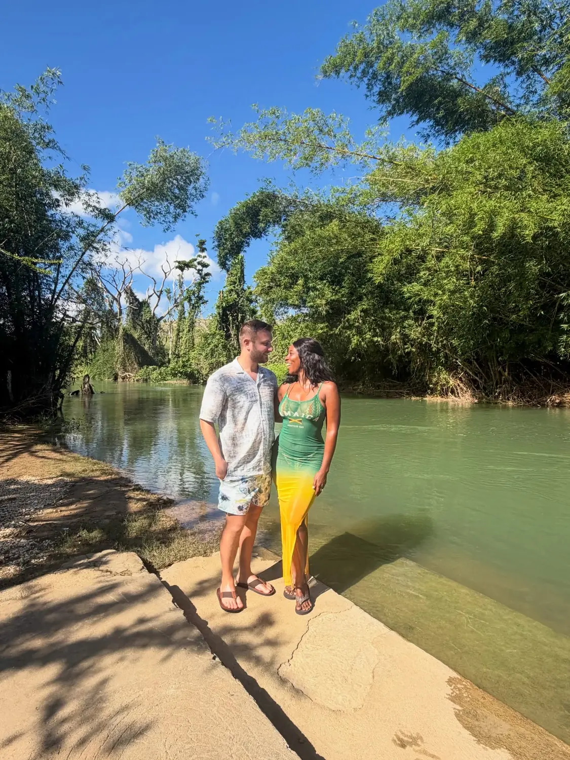 Us by the green Martha Brae River lined with bamboo