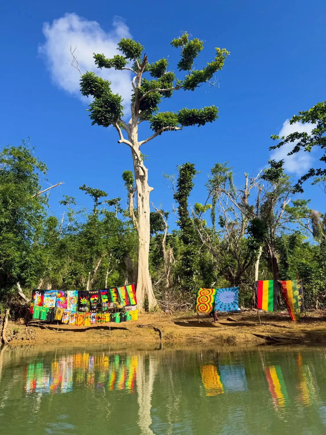 Colourful Jamaican craft and towels for sale on the Martha Brae riverbank