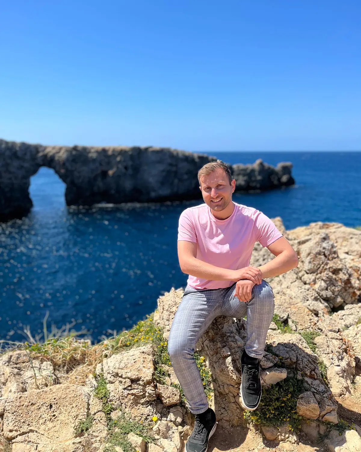 Andrew on the rocks beside the Pont d'en Gil natural sea arch in Menorca