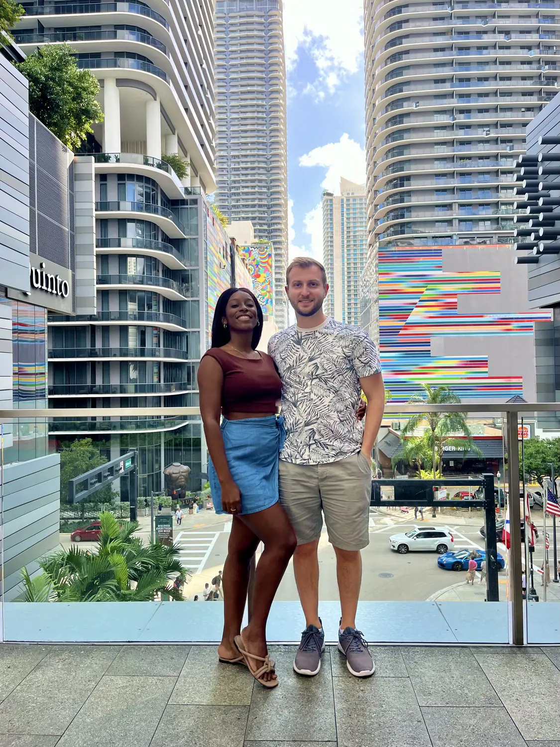 Us in downtown Miami with colourful high-rise buildings behind