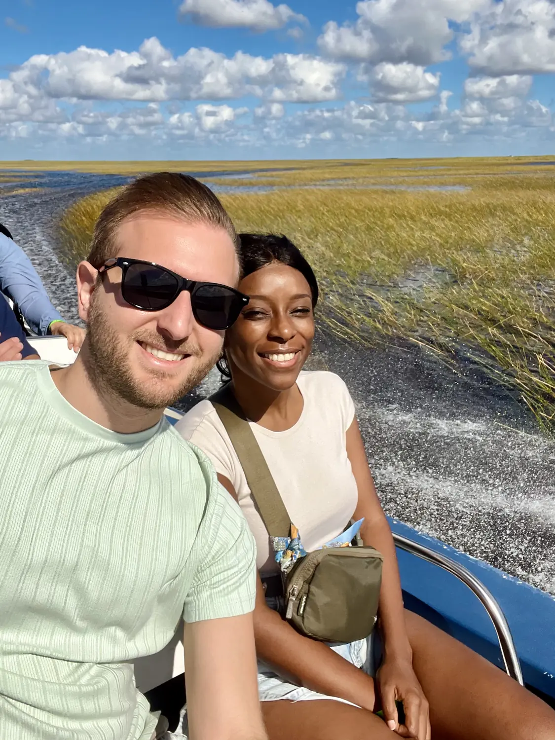 Selfie of us on an airboat gliding through the Everglades sawgrass