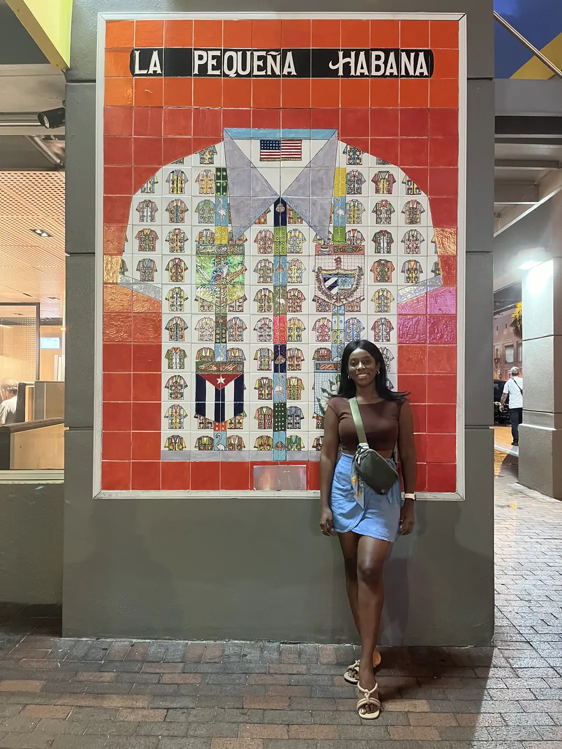 Melody by the La Pequeña Habana tiled monument in Little Havana, Miami