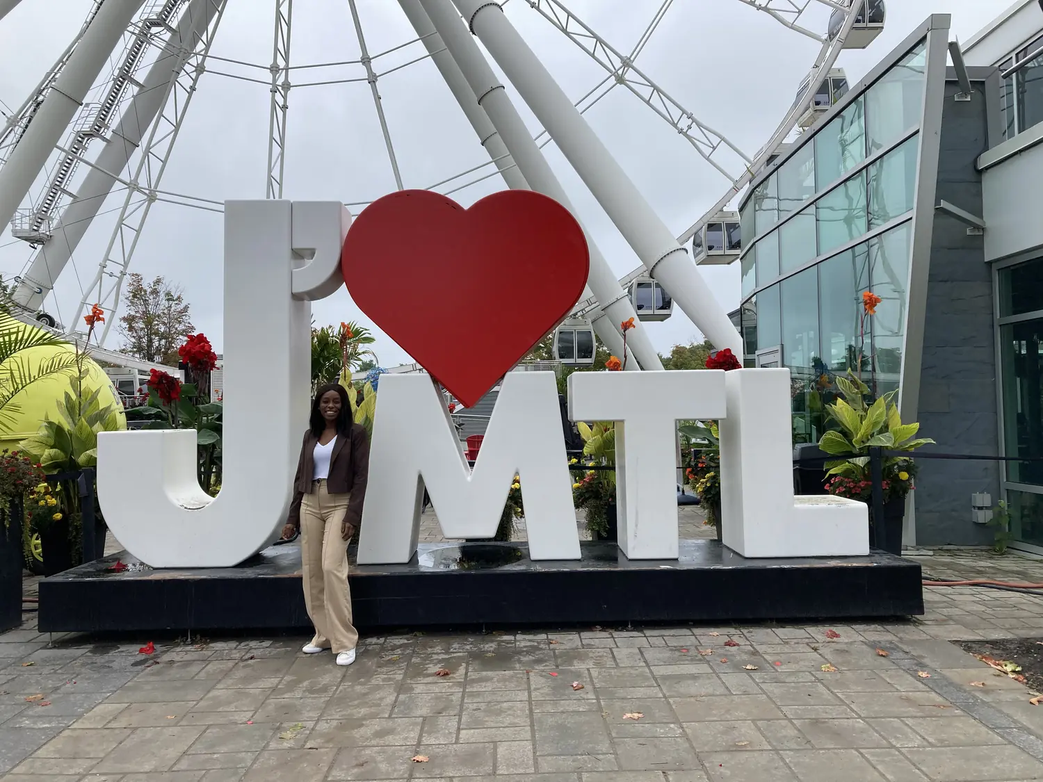 Melody at the giant J love MTL sign in Montreal's Old Port