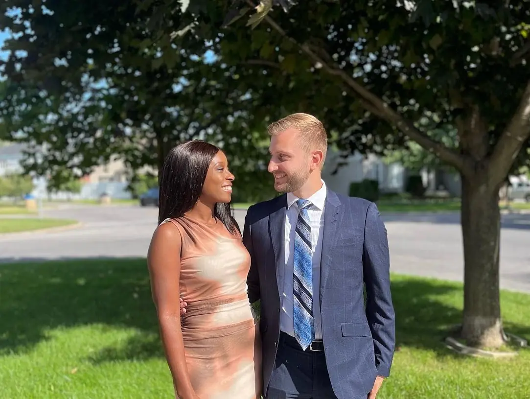 Us dressed up under a leafy tree on a sunny summer day in Montreal's West Island