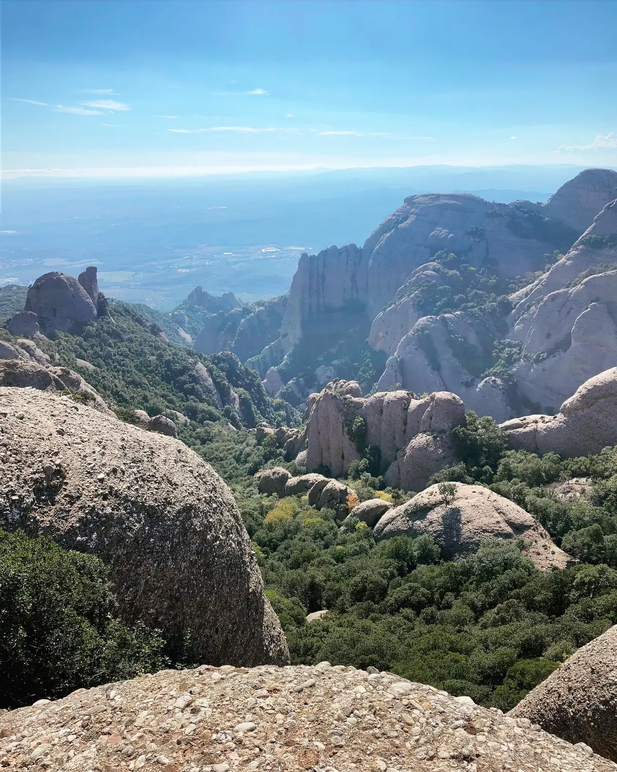 The dramatic rounded rock formations of the Montserrat massif under a blue sky