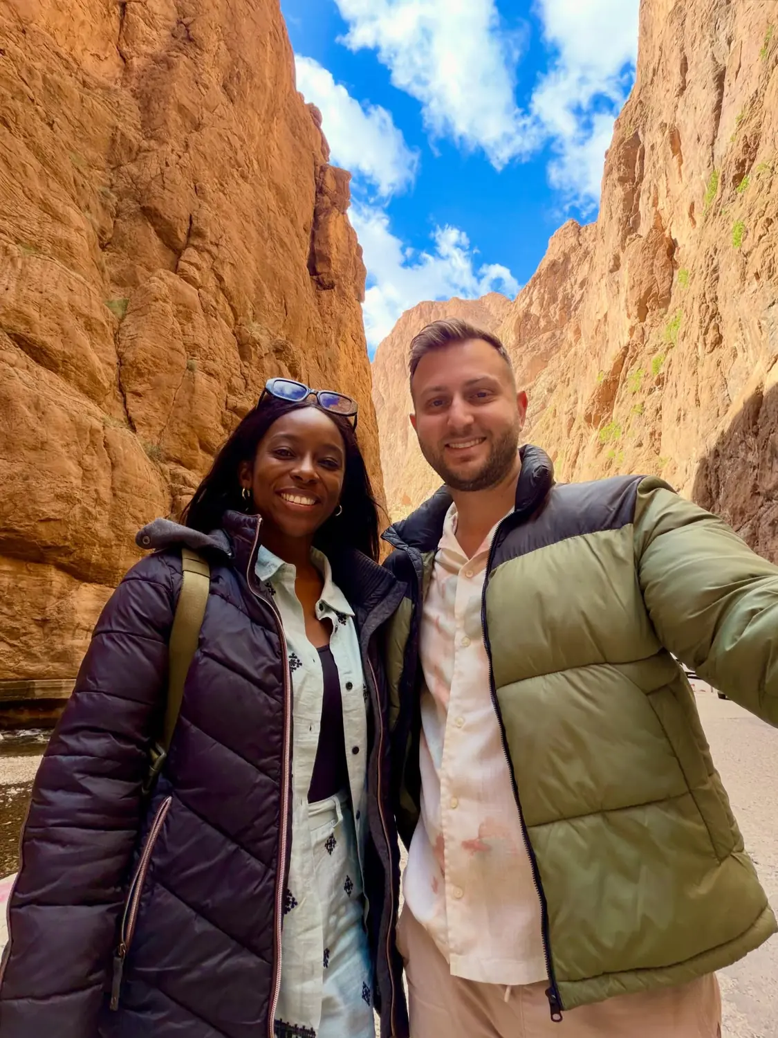 Us in the narrow towering walls of the Todra Gorge