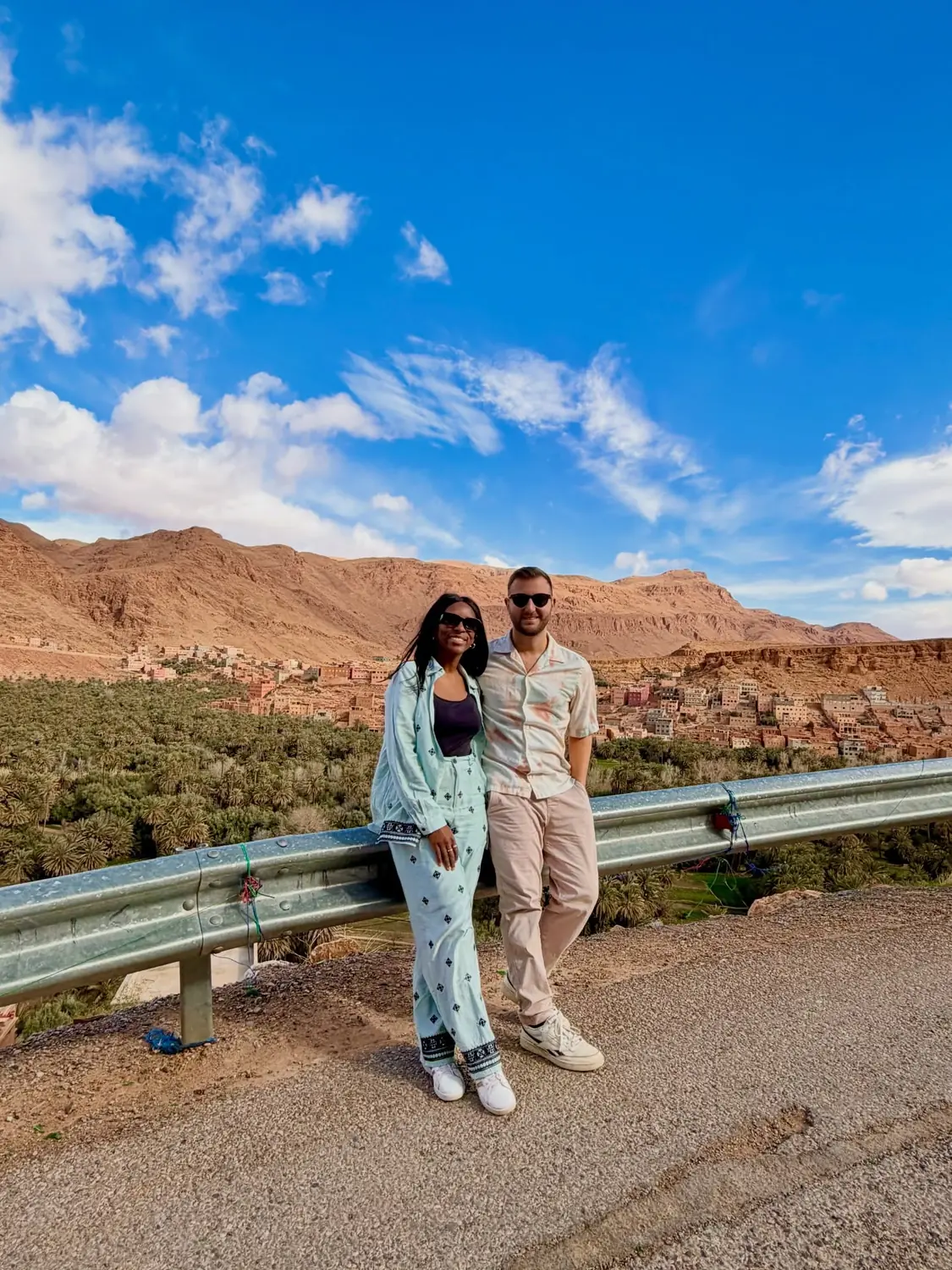 Us at a viewpoint over the Tinghir palm oasis