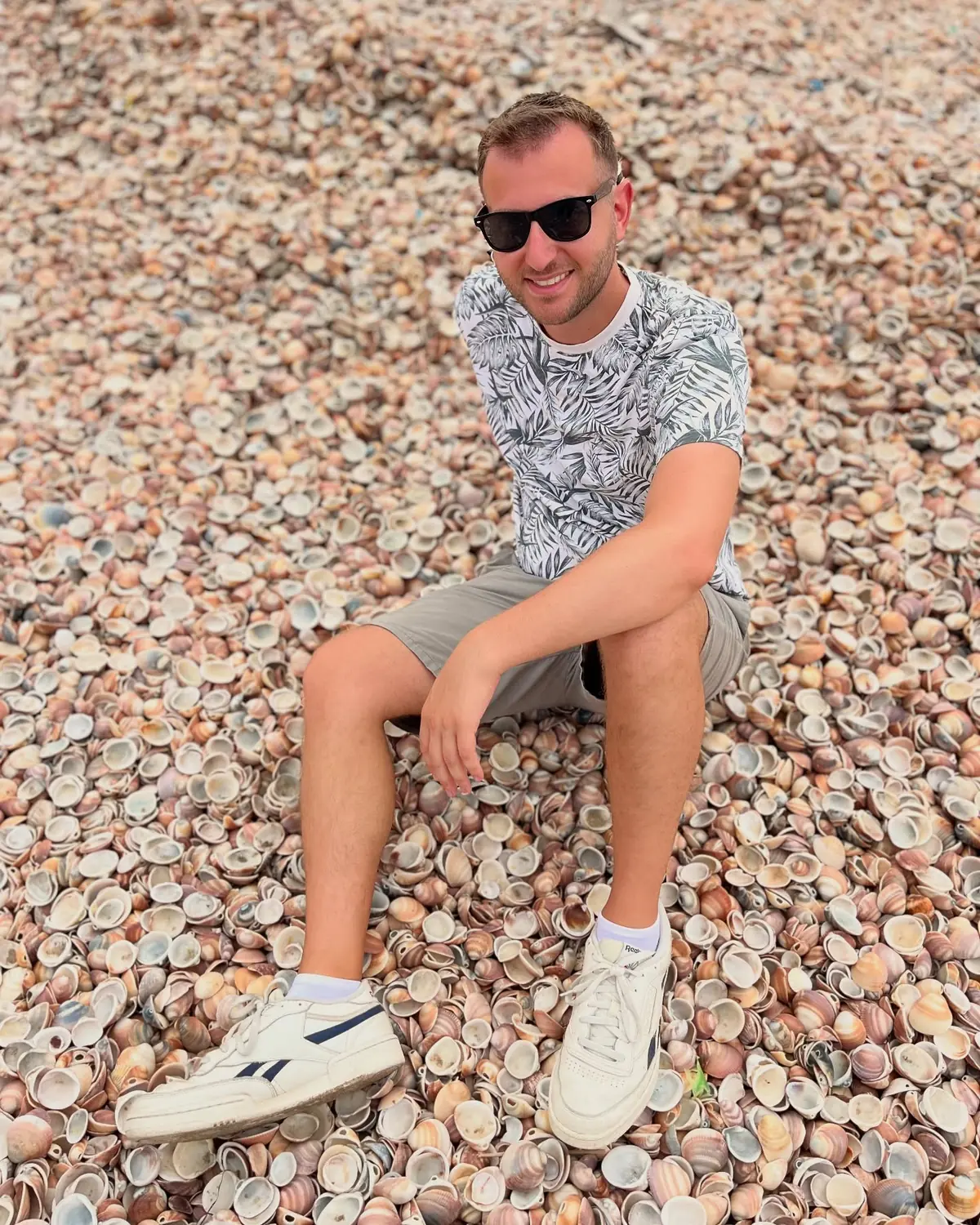 Andrew perched on the deep bed of seashells at Nador