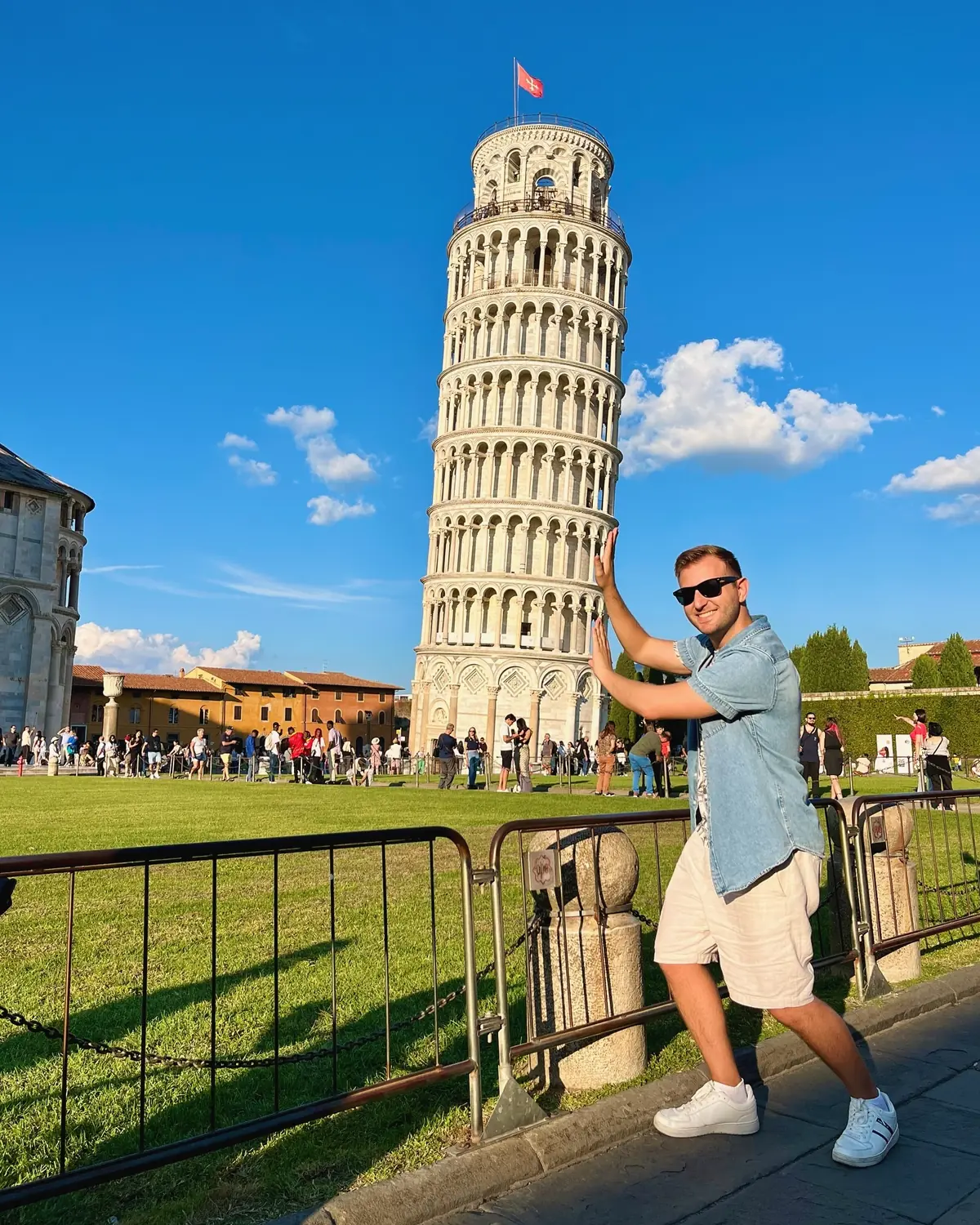 Andrew doing the classic pose pretending to hold up the Leaning Tower