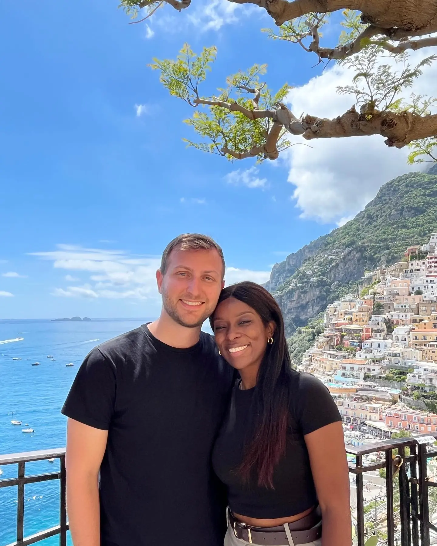Us on a terrace with the whole of Positano rising behind