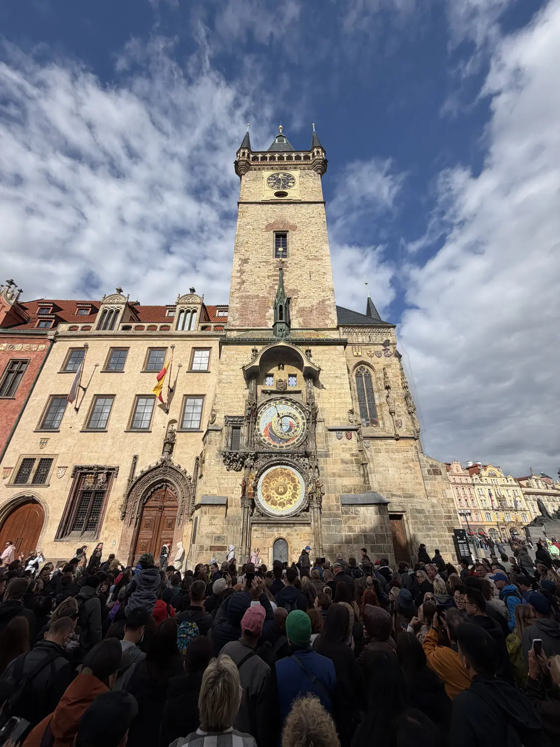Crowds gathered beneath the Old Town Hall tower and the Astronomical Clock