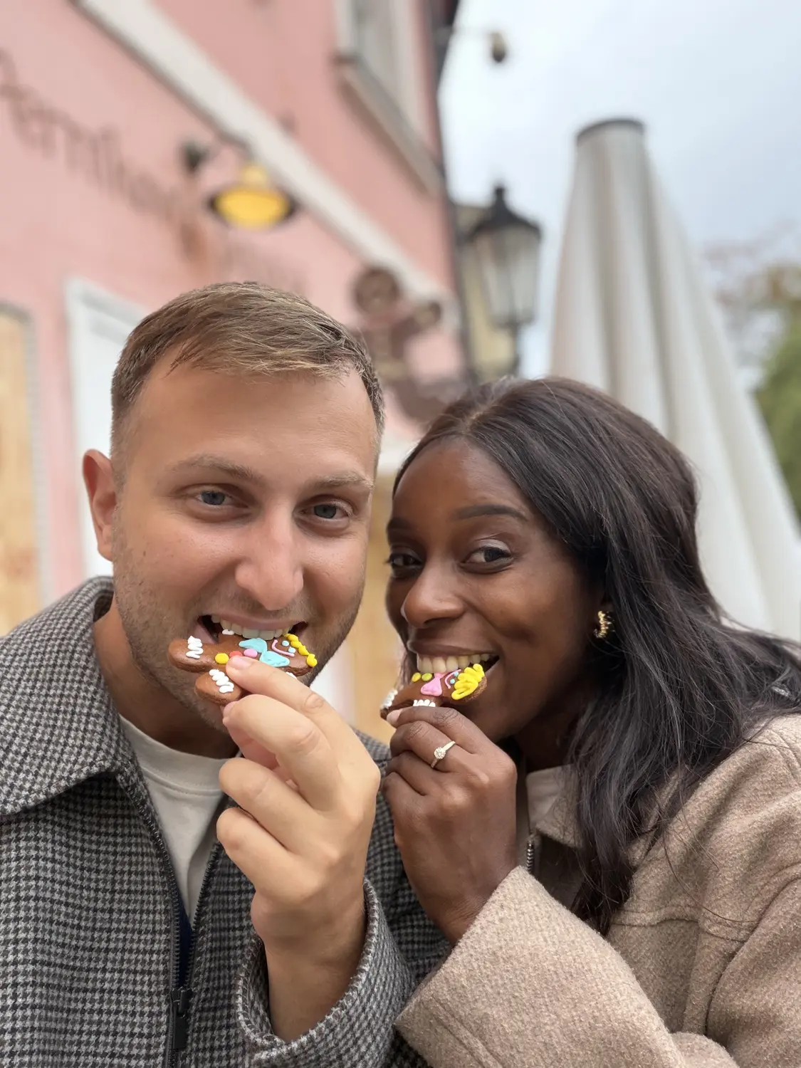 Us taking a bite of a sweet street snack together