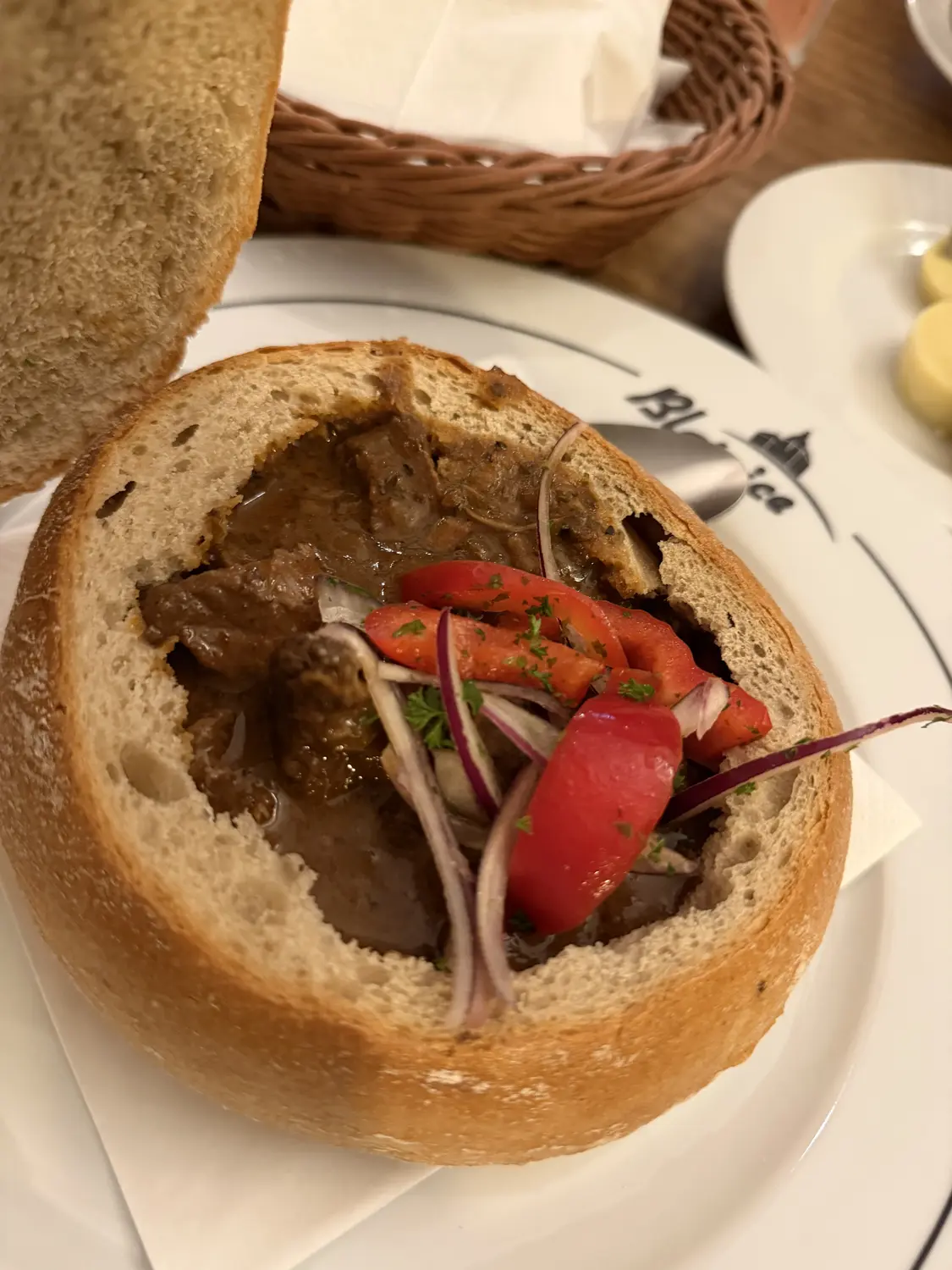 Hearty Czech goulash served in a bread bowl