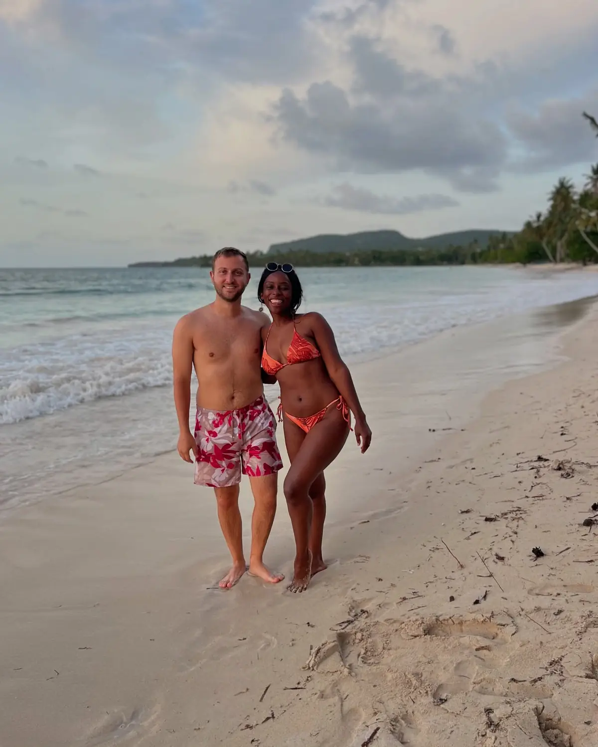 Us on a wide sandy beach at sunset in Las Terrenas, Samaná