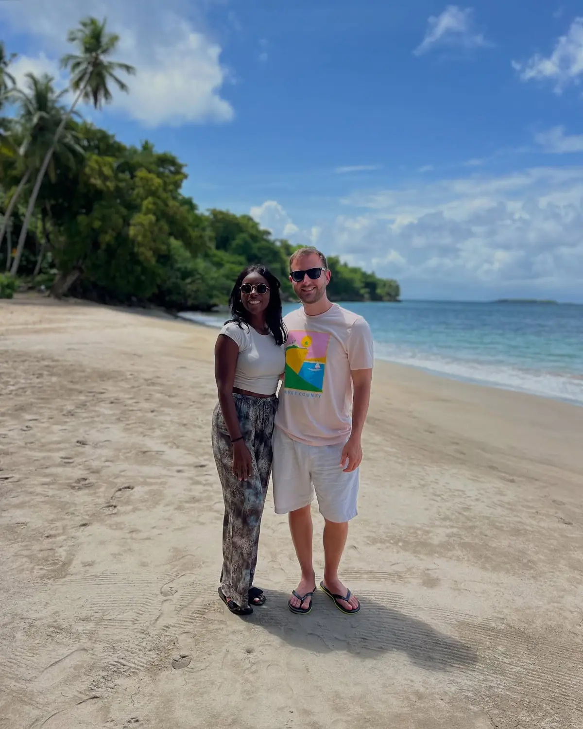 Us on a lush green cove beach near Las Galeras, Samaná