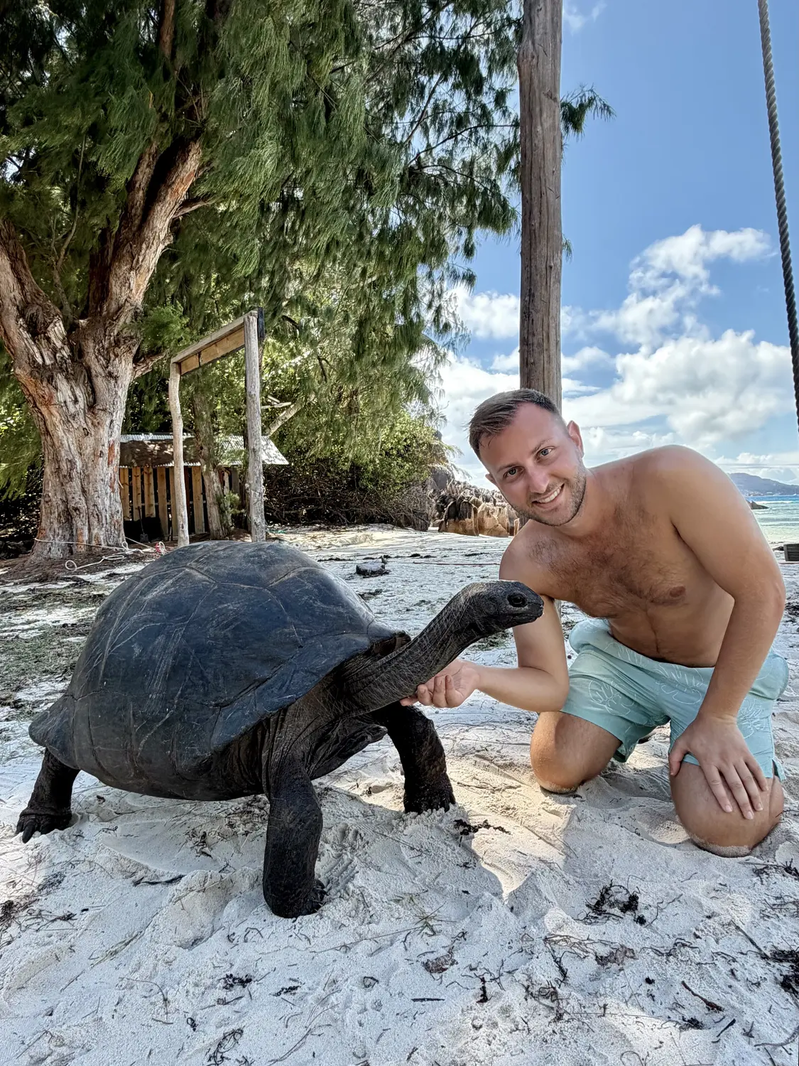 Andrew with a giant tortoise on Curieuse