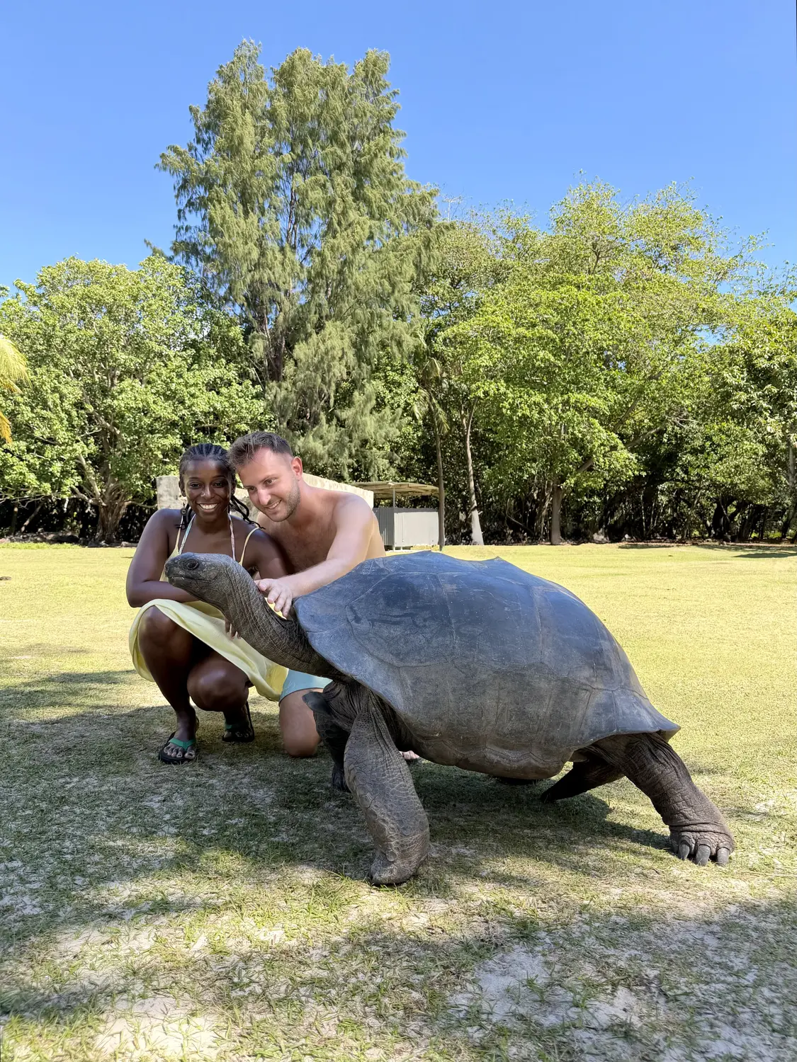 Us with a giant tortoise on Curieuse