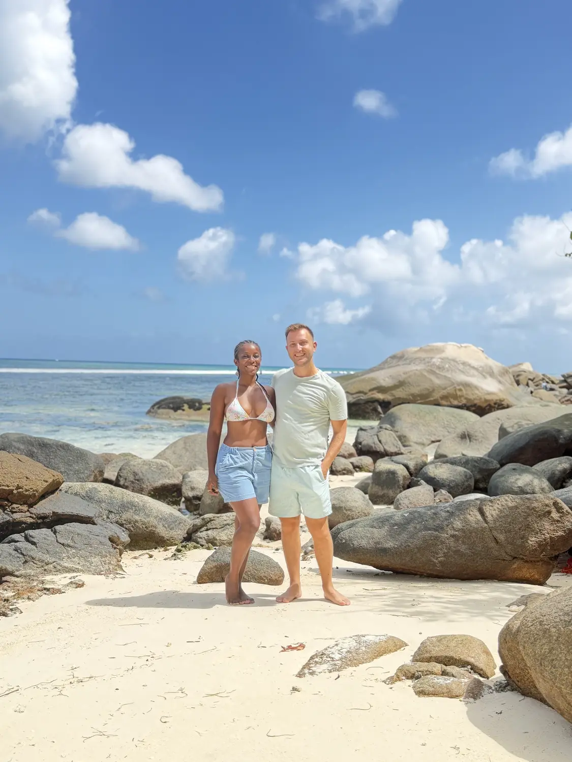 Us on a quiet sandy cove of granite boulders at the end of Beau Vallon, Mahé