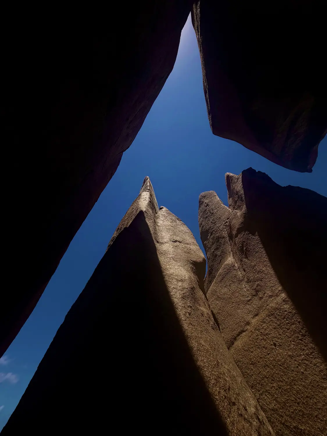 Looking up through granite spires, La Digue