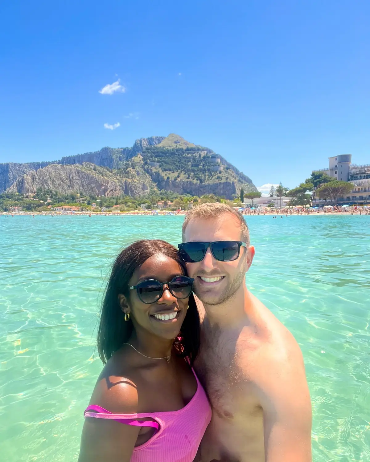 Selfie of us in the turquoise sea at Mondello beach with the mountain behind