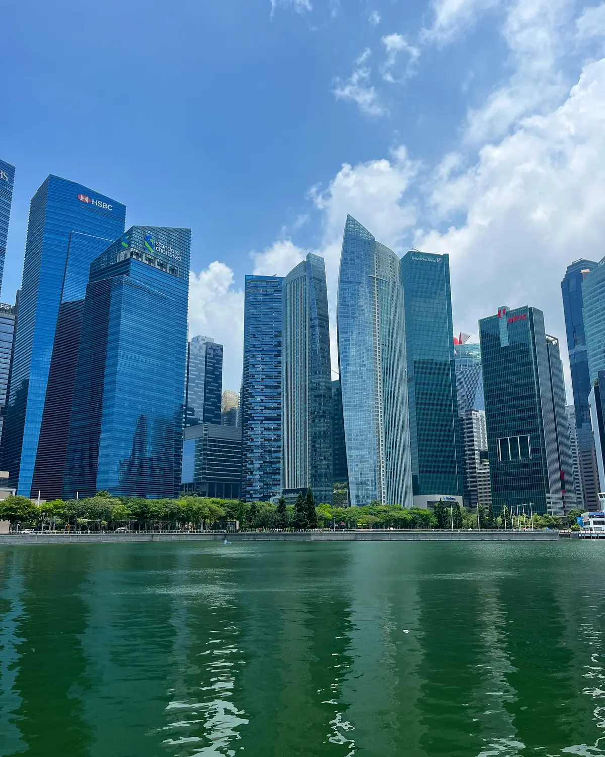 Singapore's CBD skyline reflected in the bay by day